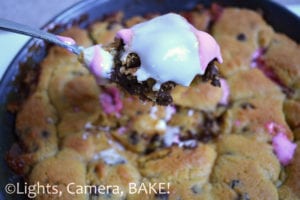 S'mores Cookie Pie is the definition of comfort food! Rich, buttery and packed full of chocolate, marshmallows and crushed digestives. This is an ooey gooey treat to die for! Click the photo for the #recipe . #cookiepie #smores