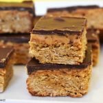 Peanut butter oat slice on a white plate.