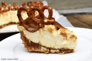 Salted Caramel Cheesecake is rich, creamy and sweet. This is a no bake salted caramel cheesecake with a digestive biscuit (Graham cracker) and salted pretzel crust with a homemade salted caramel sauce and salted caramel cheesecake filling. #saltedcaramelcheesecake #saltedcaramel #nobakecheesecake #nobakessaltedcaramelcheesecake