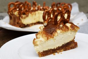 Salted Caramel Cheesecake is rich, creamy and sweet. This is a no bake salted caramel cheesecake with a digestive biscuit (Graham cracker) and salted pretzel crust with a homemade salted caramel sauce and salted caramel cheesecake filling. #saltedcaramelcheesecake #saltedcaramel #nobakecheesecake #nobakessaltedcaramelcheesecake