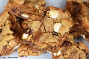 Caramel Peanut Butter Slice is a gooey, chewy, buttery and oh-so-delicious peanut butter cookie bar stuffed with caramel sauce and speckled with white chocolate and chocolate chips. #peanutbuttercookeis #caramelcookiebars #caramelcookiebars #peanutbuttercaramelslice #caramelslice #cookiebars