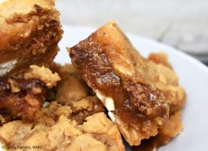 Caramel Peanut Butter Slice is a gooey, chewy, buttery and oh-so-delicious peanut butter cookie bar stuffed with caramel sauce and speckled with white chocolate and chocolate chips. #peanutbuttercookeis #caramelcookiebars #caramelcookiebars #peanutbuttercaramelslice #caramelslice #cookiebars