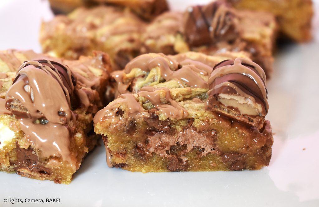 Gooey slice of blondie on a plate.